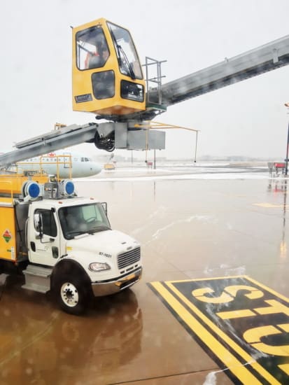 De-icing the plane before leaving Toronto